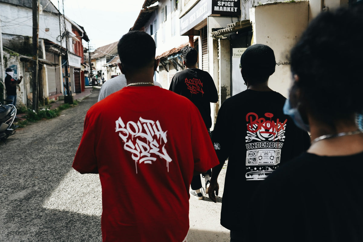 Friends walking down a city street in casual streetwear